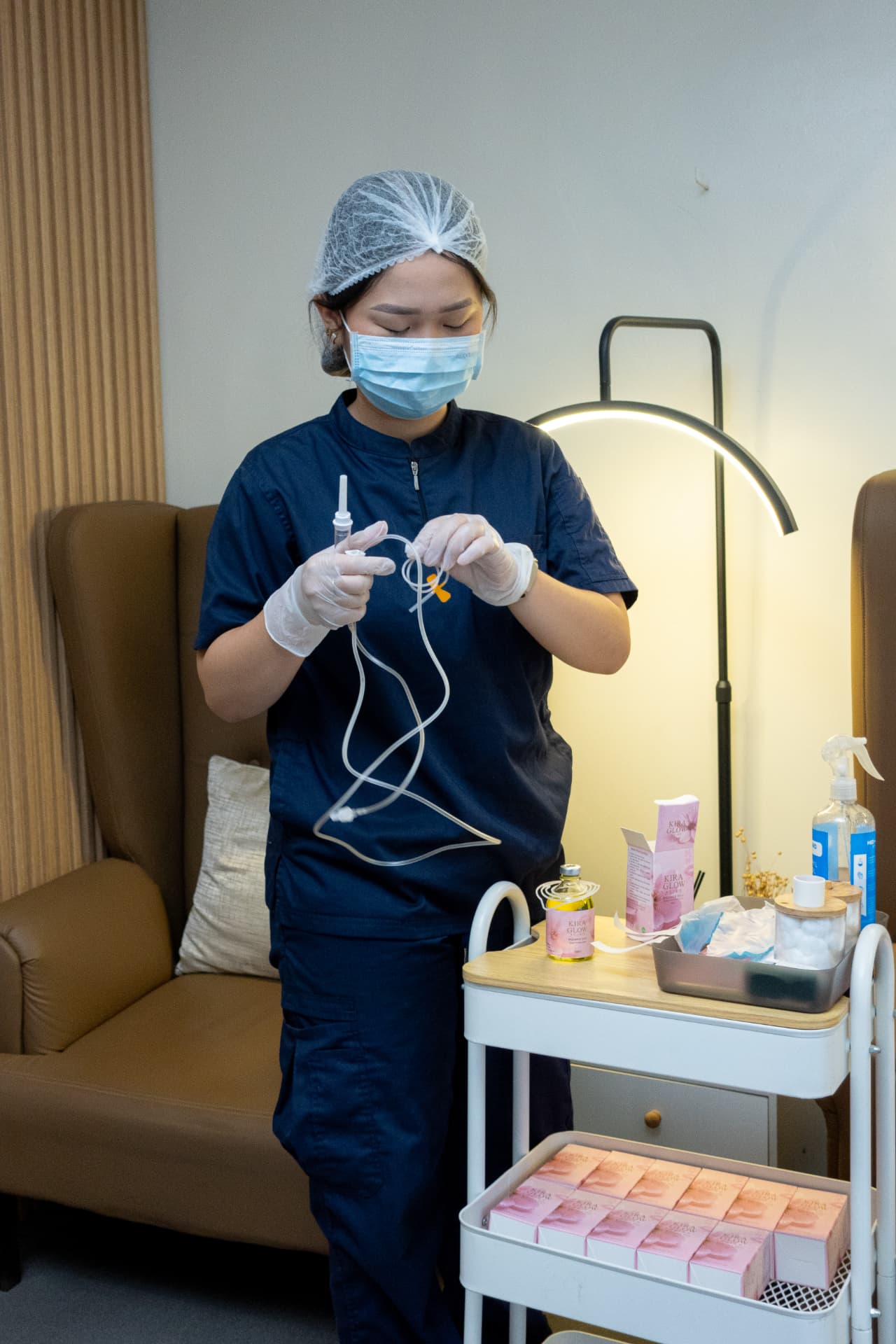 Clinic staff preparing sterile single-use IV materials